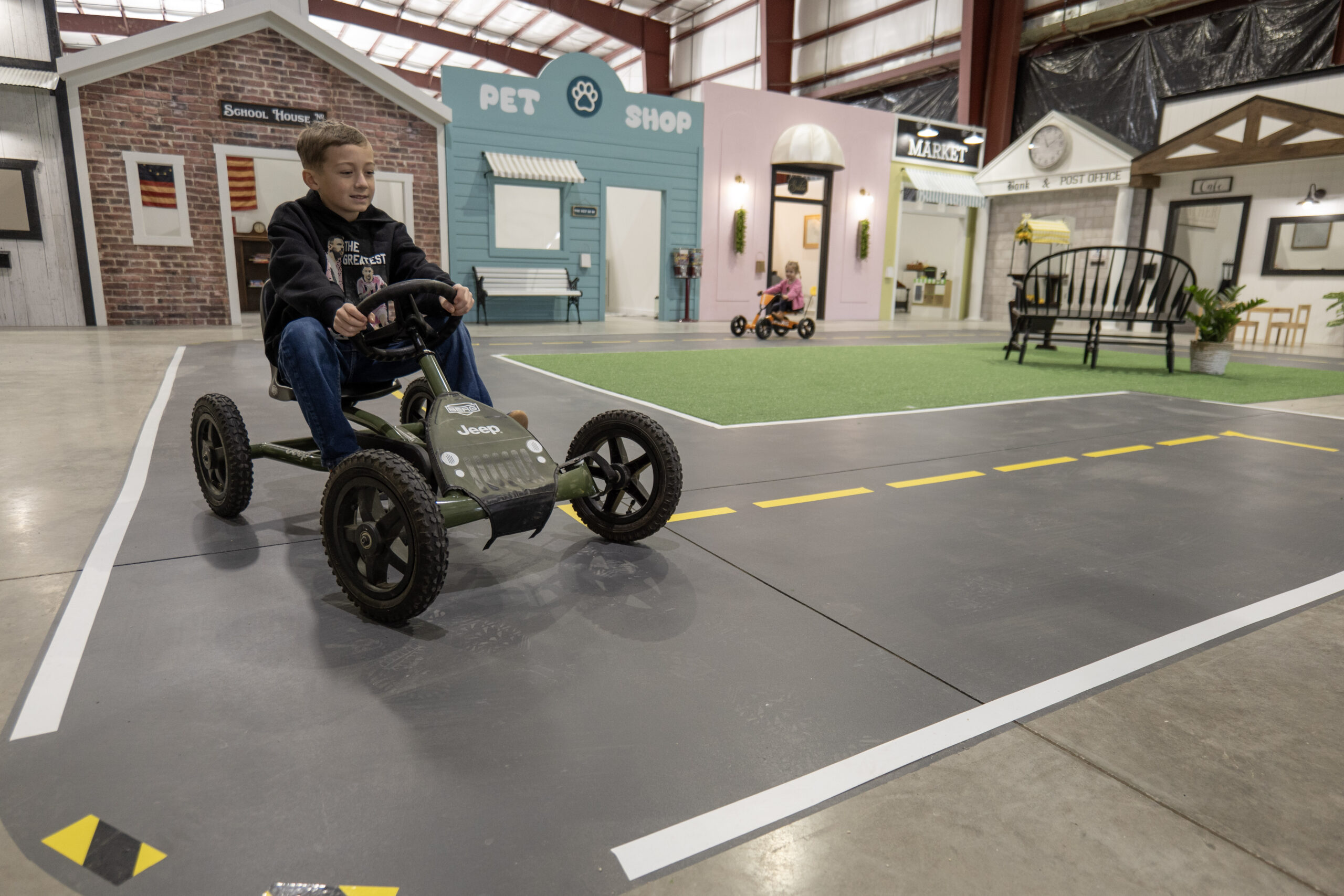 Young Boy drives around Lincway's Kids Play Town